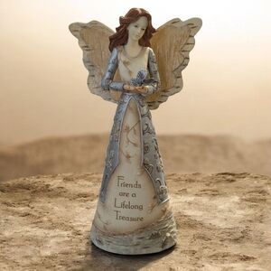 angel figurine with butterfly and little note